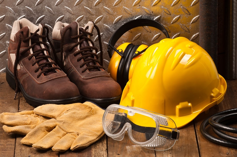 Safety equipment including a hard helmet, safety boots, safety gloves, goggles and earmuffs