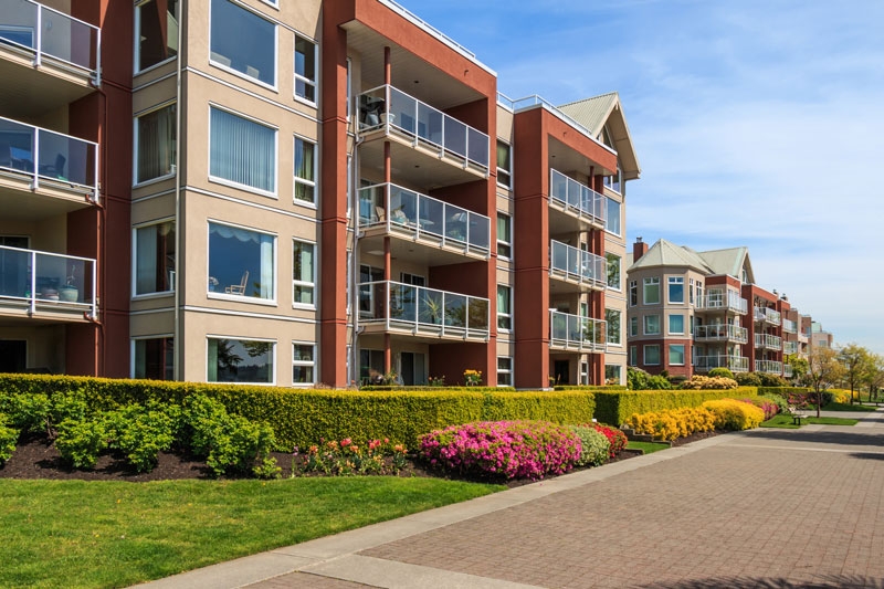 The front of a large residential building such as a condo complex or apartment building